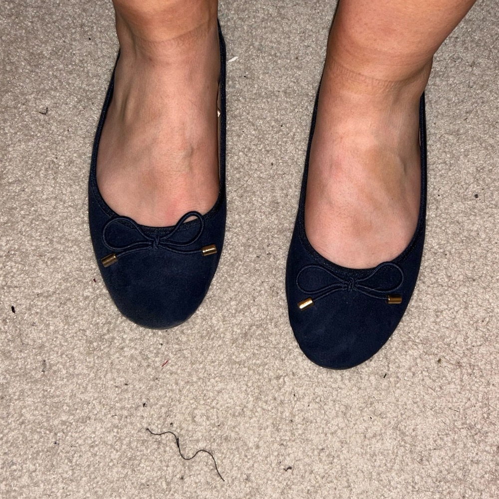 Well worn women’s work flats
